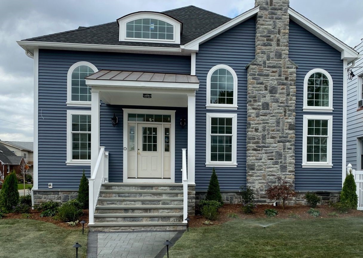 Residential home with new blue siding